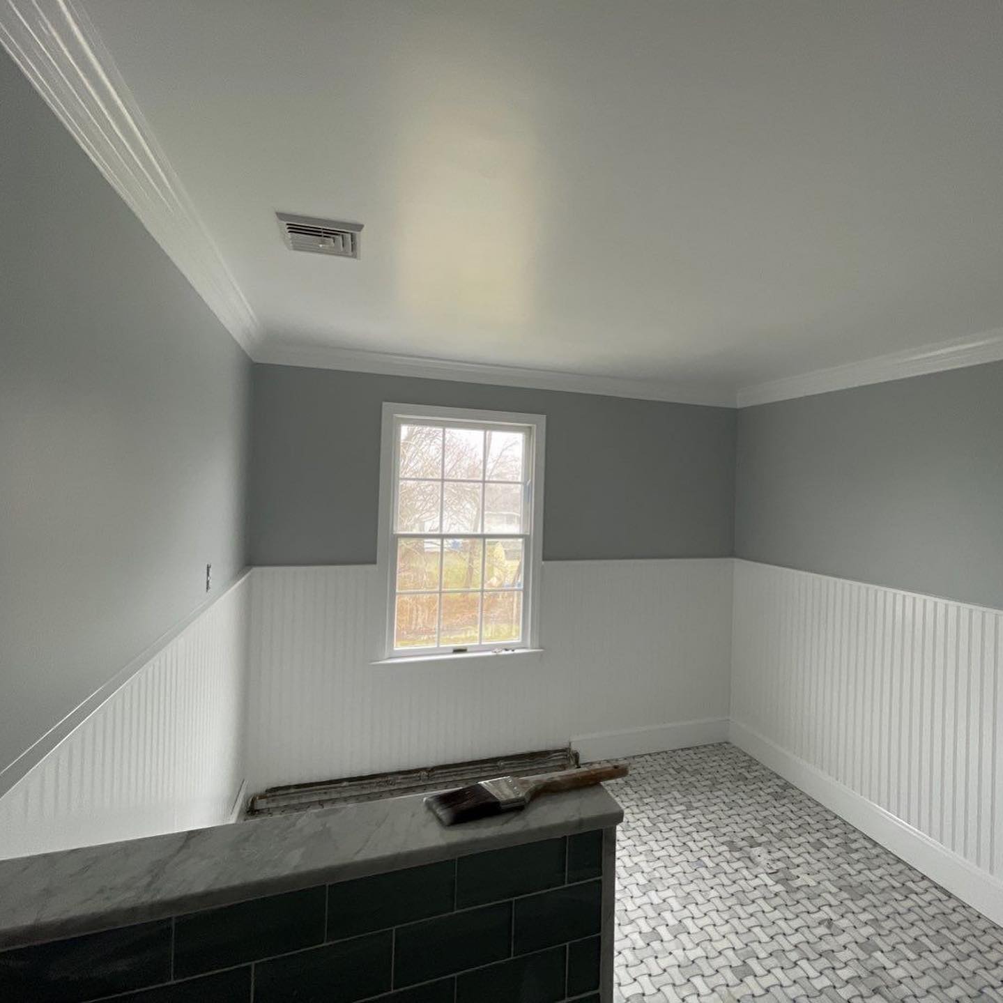 A carpentry project to elevate your home is adding wainscoting to a room.